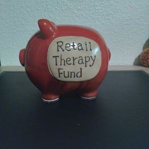 Piggy bank,words retail therapy fund
